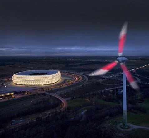 Ночью на пару со стадионом светящийся ветряк-монстр образует просто феерическое зрелище (фотографии Siemens).